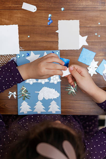 istock Little girl making Christmas cards 499171074