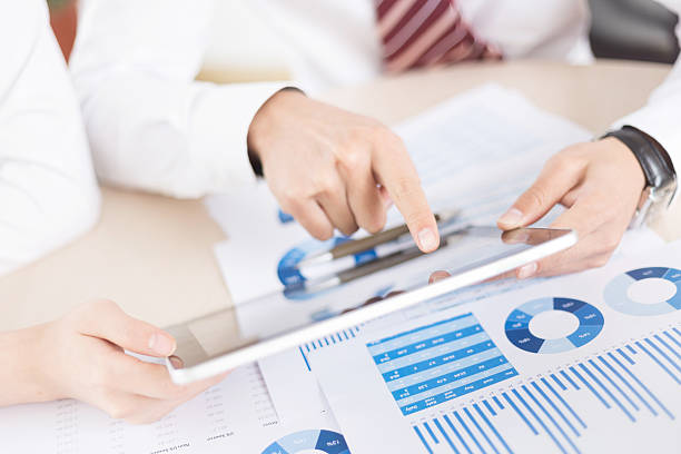 istock Modern people doing business, graphs and charts being demonstrat 499171171