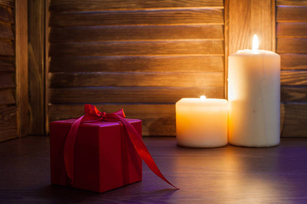 istock gift in red box and pearls beads on wooden background 499171304