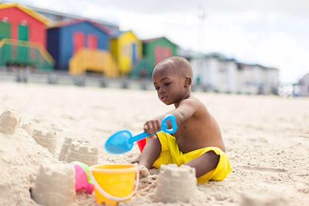 istock African toddler playing in the sand 499171637