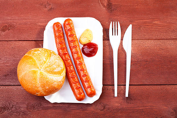 istock Roasted sausage with bread served on a paper tray 499173195