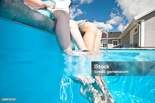 Feet In The Swimming Pool Stock Photo - Download Image Now - Child, House, Swimming Pool