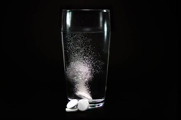 istock Dissolving tablet into glass of water 499174597
