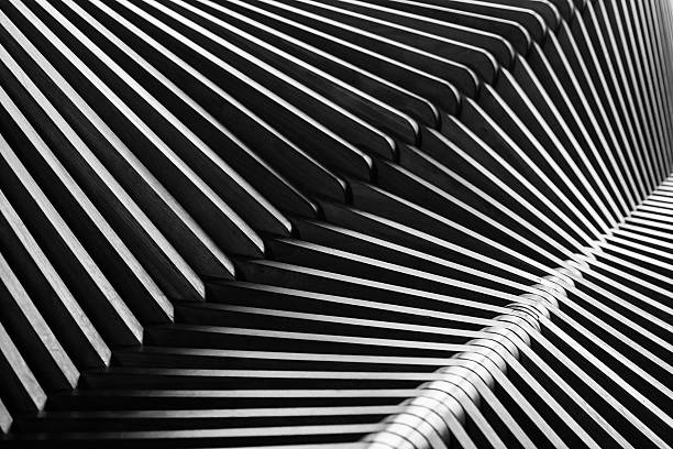 Abstract composition, cross the lines, zebra effect Black and white shiny curved wooden structure on bench. zebra photos stock pictures, royalty-free photos & images