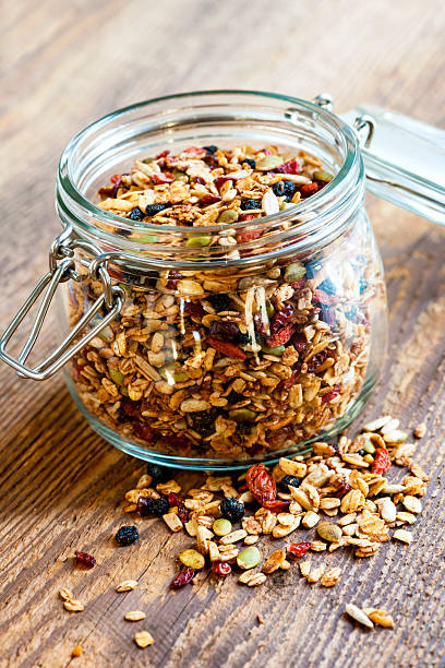 istock Homemade granola in open glass jar 499176653