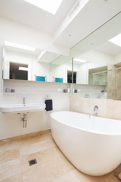 istock Master bathroom clean white with large bathtub in luxury home 499176806