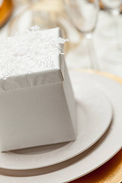 istock Christmas or Wedding Gift with Place Setting at Elegant Table 499176950