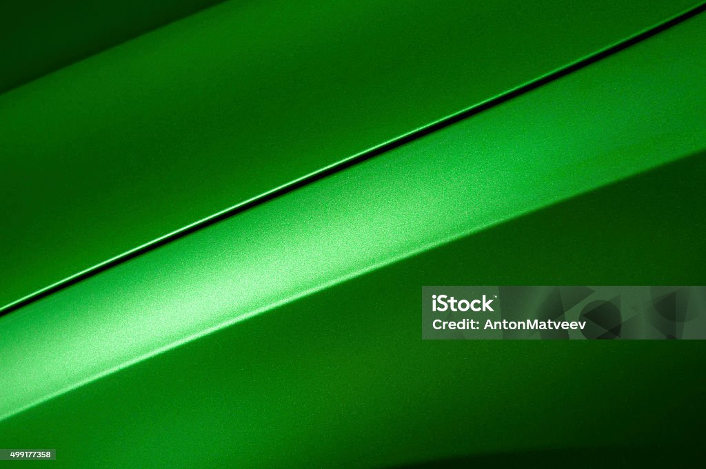 Green sedan bodywork Surface of green sport sedan car, detail of metal hood, fender and door of vehicle bodywork Car Stock Photo