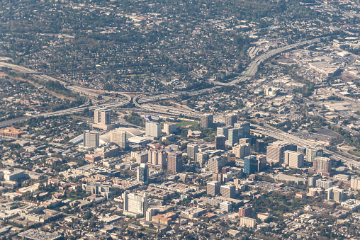 Aerial view of San Jose looking south west. The highway interchange is Interstate 280 and California Highway 87. City hall can be seen in the lower left of the picture as is San Jose State University.