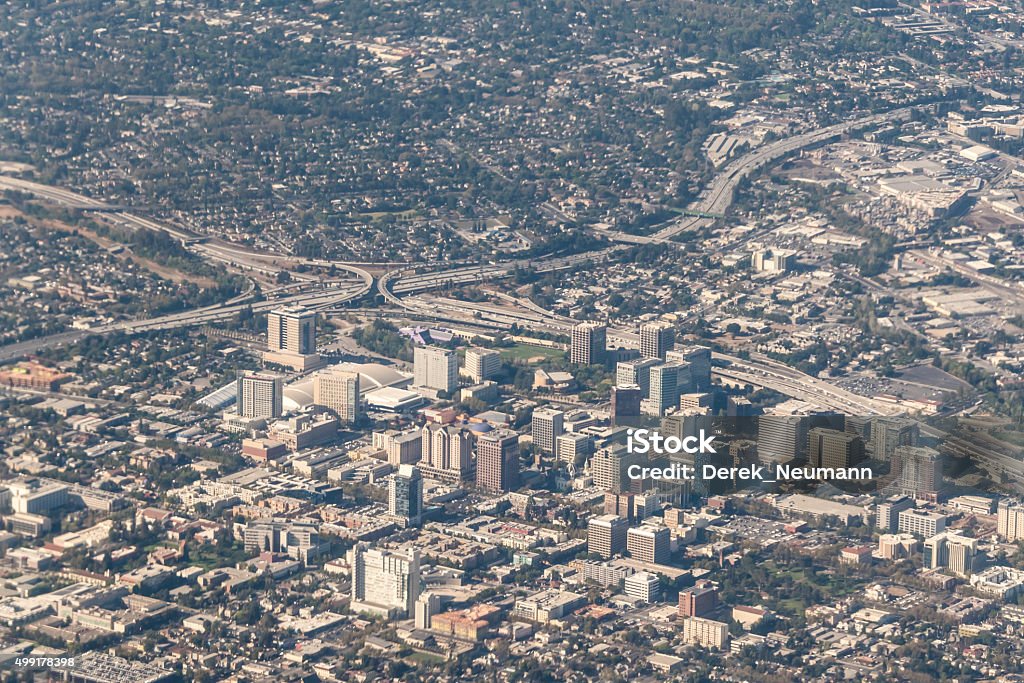 Downtown San Jose, California Aerial view of San Jose looking south west. The highway interchange is Interstate 280 and California Highway 87. City hall can be seen in the lower left of the picture as is San Jose State University. Downtown District Stock Photo