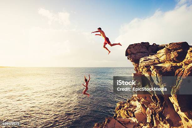 Summer Fun Cliff Jumping Stock Photo - Download Image Now - Adventure, Vacations, Fun