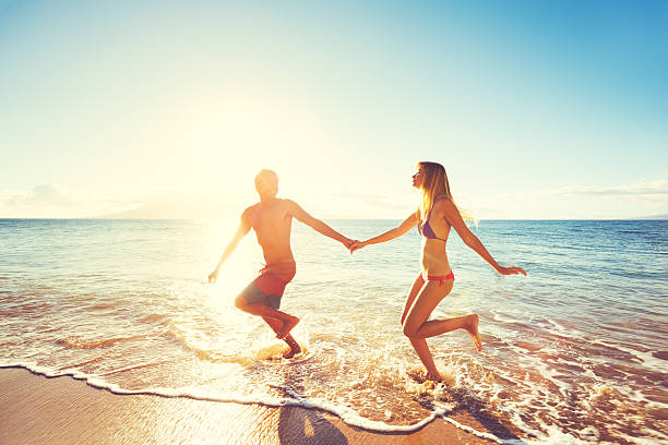 istock Happy Sunset Couple at the Beach 499180638