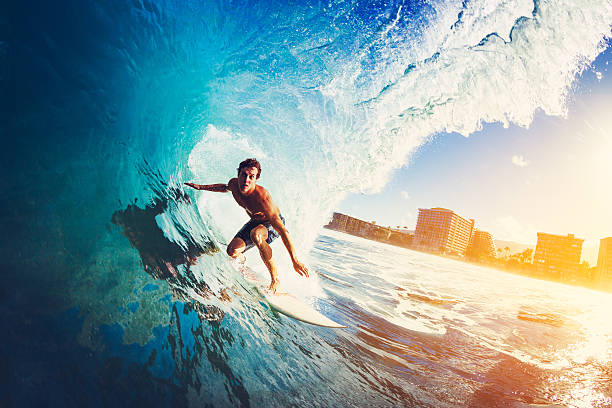 surfer on blue ocean wave - surfing surfboard summer heat fotografías e imágenes de stock