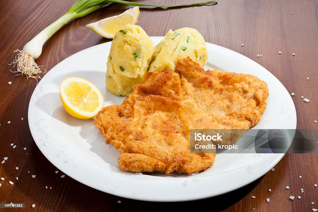 Vienna schnitzel with potato puree Vienna schnitzel with potato mash potatoes 2015 Stock Photo