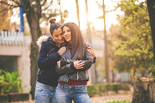 istock Two girls cuddling in the park! 499183152
