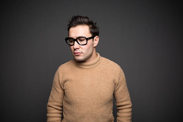 istock Portrait of real young man looking down 499183818