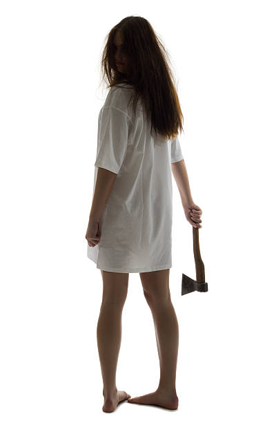 Zombie girl with axe isolated on white