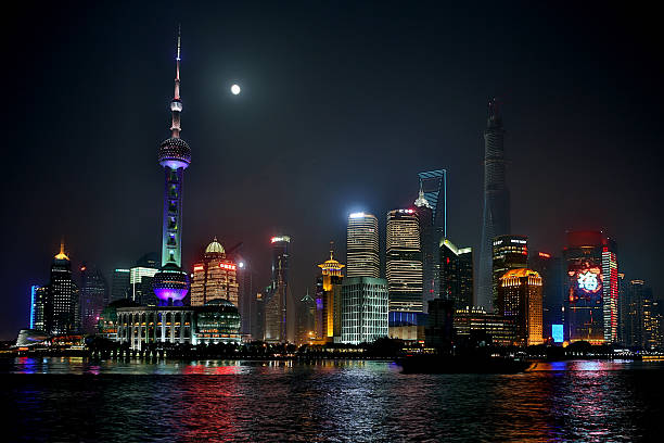 istock New Shanghai Pudong skyline with a full moon 499190103