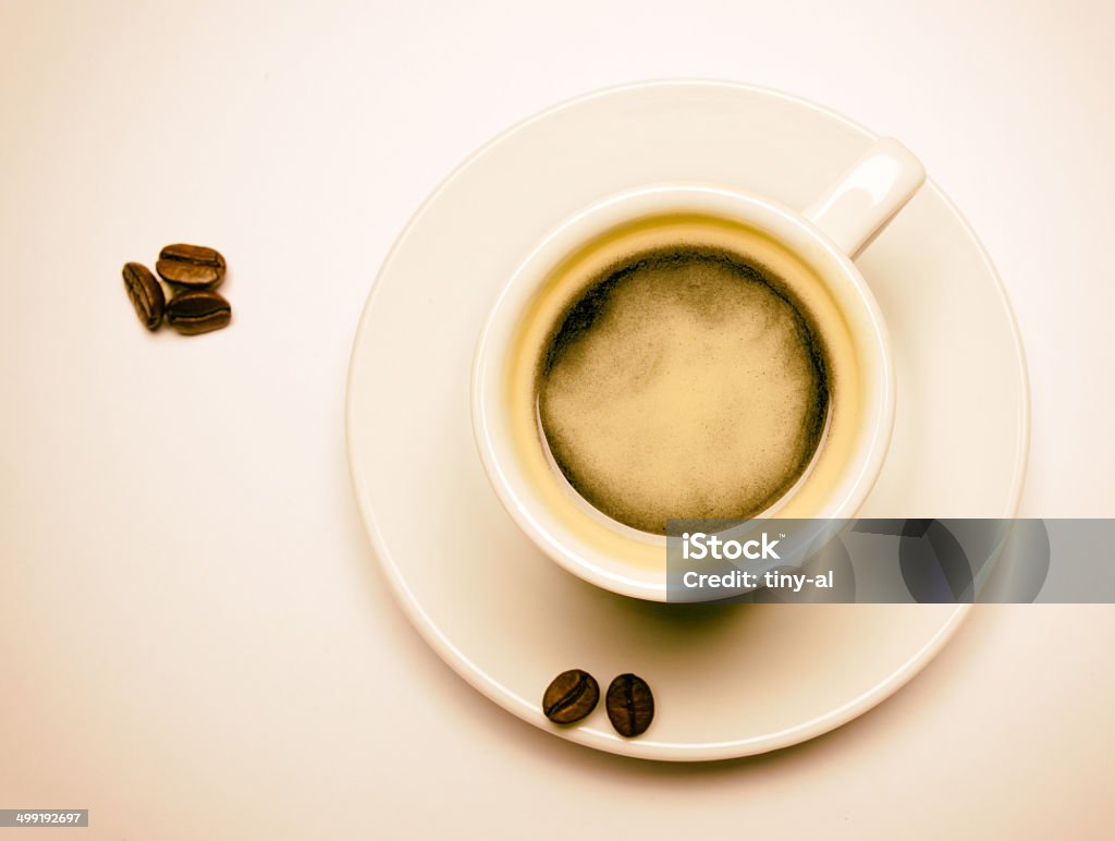Coffee cup decoradet with roasted coffee beans Traditional black espresso in a mug, decorated with coffe beans. Image is in a sepia/retro look Art Stock Photo