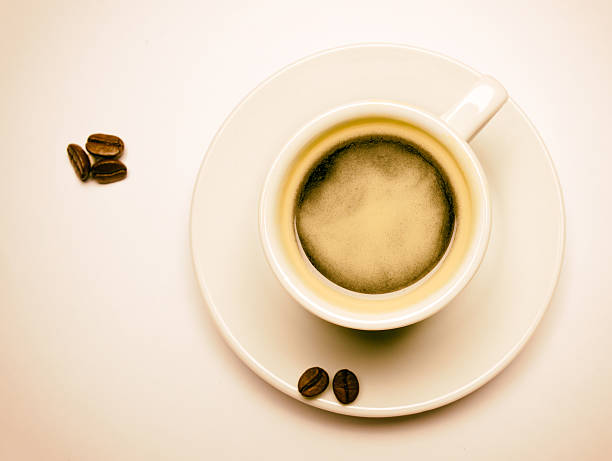 Coffee cup decoradet with roasted coffee beans stock photo