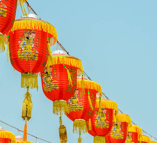 istock Chinese red lanterns hanging on blue sky 499198420