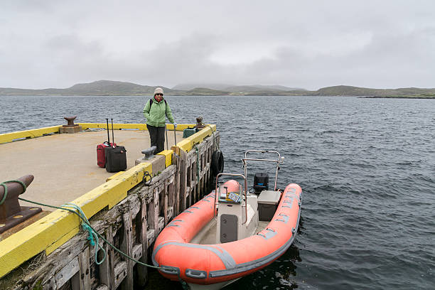 istock Newfoundland Woman Standing on Dock 499204234