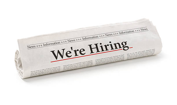 istock Rolled newspaper with the headline We are hiring 499205224
