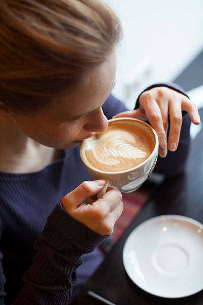 istock middle-aged woman drinking morning coffee 499206560