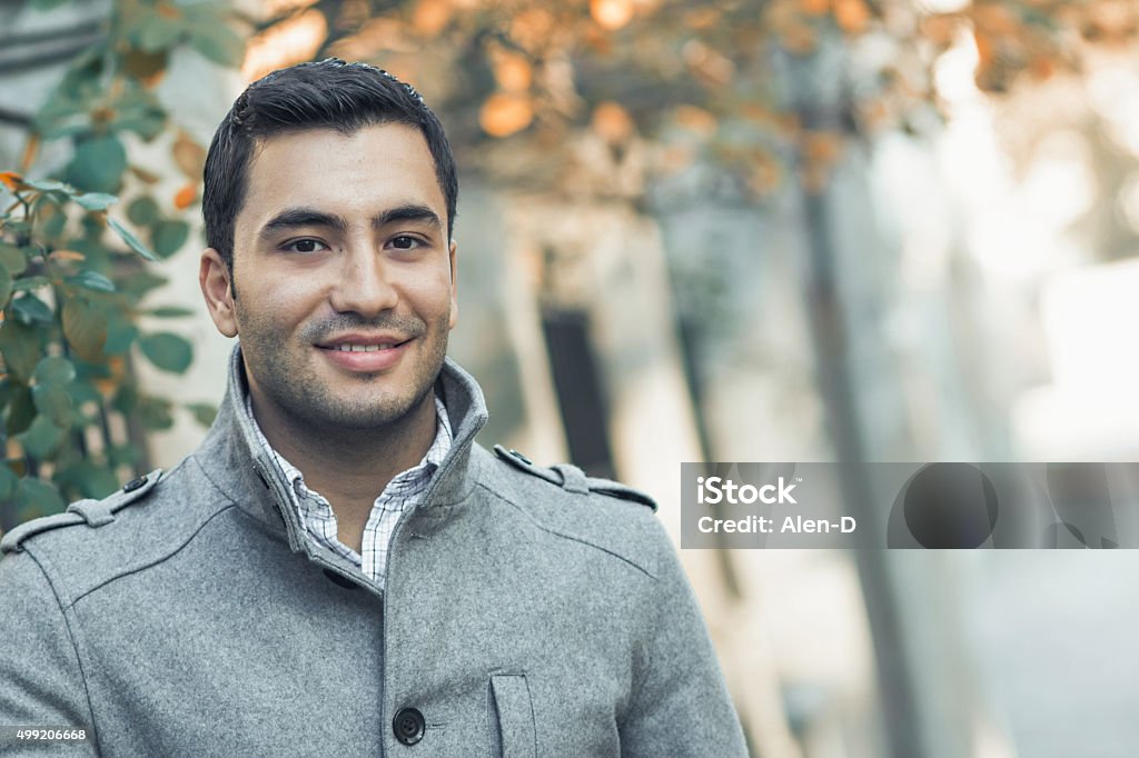 Turk or arab young man Portrait od smiling gorgeous young attractive man, outdoor - outside coldly morning Men Stock Photo