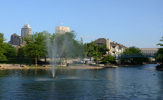 Indianapolis, IN, USA - June 17, 2014: A fountain in Indianapolis' Canal Walk on June 17, 2014. The three mile loop is a popular walking and jogging trail in downtown Indianapolis.