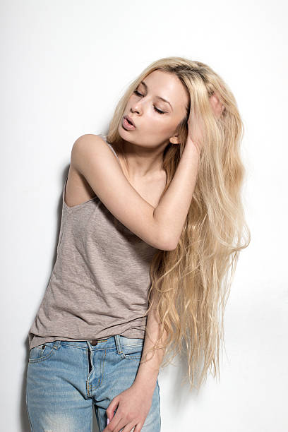 istock attractive sexy blond fashion model posing in studio 499207298