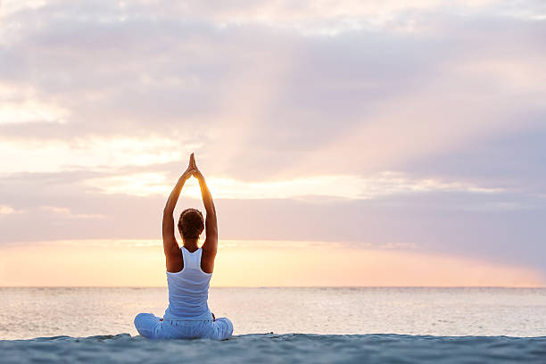 istock Caucasian woman practicing yoga at seashore 499207968