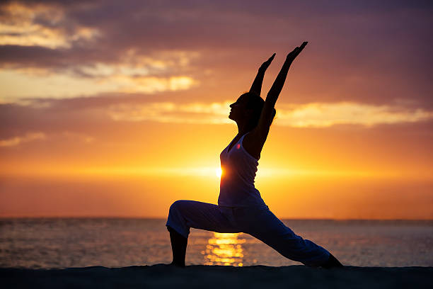 istock Caucasian woman practicing yoga at seashore 499208122