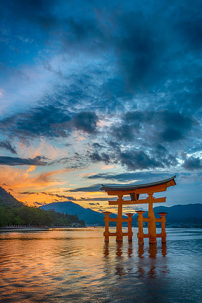 Sunset At The Floating Torii Gate Of The Itsukushima Shrine Stock Photo -  Download Image Now - iStock
