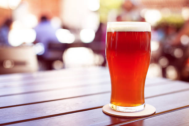 istock Pint of crafted ale on wooden table 499208990