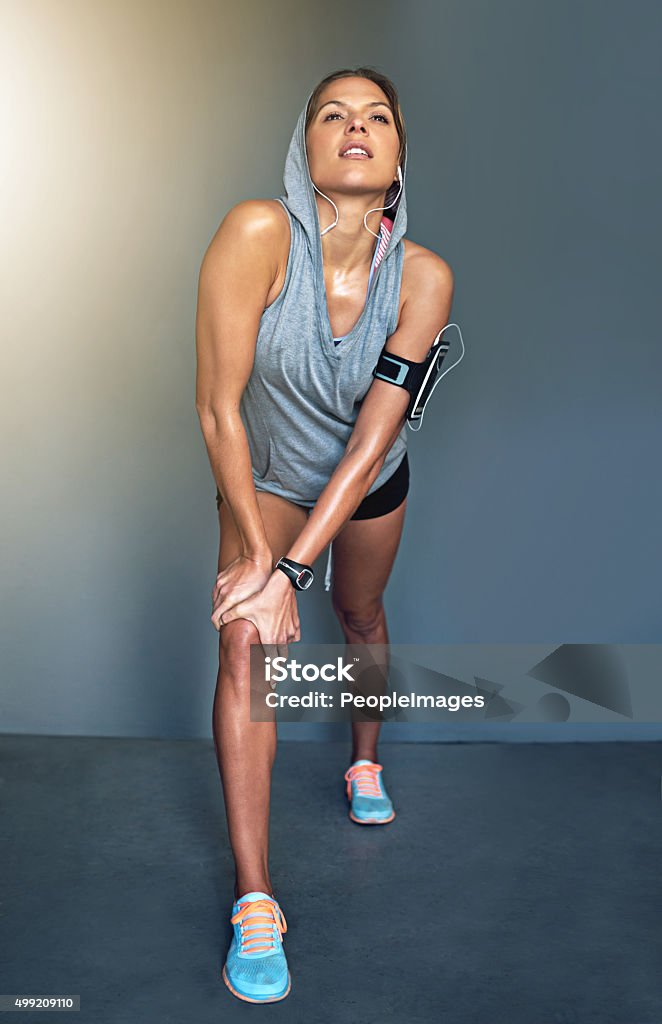 Keep your head high and your glutes tight Shot of a fit young woman lunging during her workouthttp://195.154.178.81/DATA/i_collage/pi/shoots/805991.jpg 20-29 Years Stock Photo
