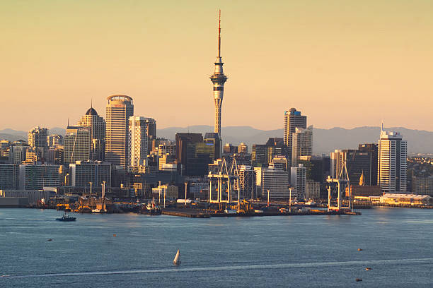 Auckland Skyline - Dawn Auckland skyline at sunrise. Waitemata Harbor stock pictures, royalty-free photos & images