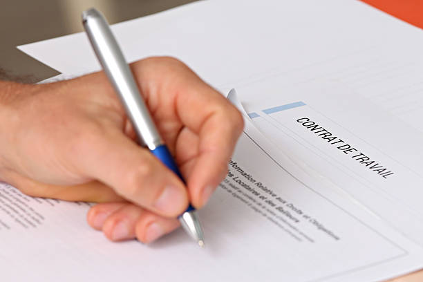 istock signing a French employment contract 499209548