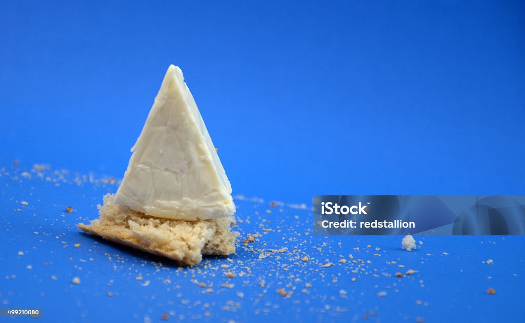 Processed cheese picture of a processed cheese on a blue background Cheese Spread Stock Photo