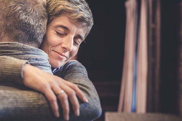 istock Senior couple embrace in kitchen 499210610
