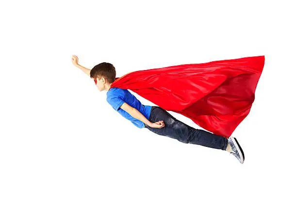 happiness, freedom, childhood, movement and people concept - boy in red superhero cape and mask flying in air