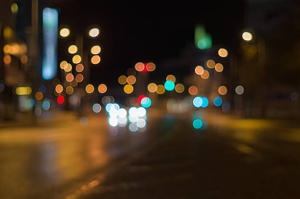 istock City traffic night blurred background with bokeh lights 499211334