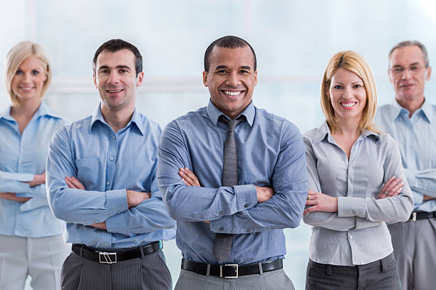 istock Confident business team with arms crossed looking at camera. 499211764
