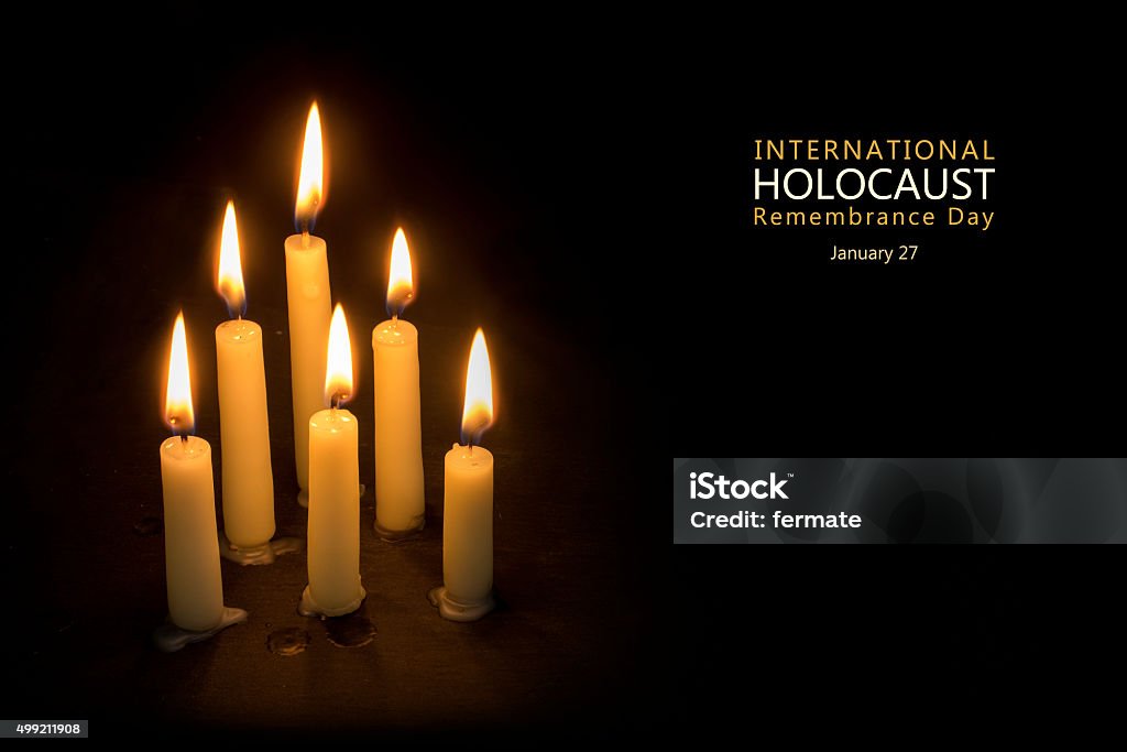 Holocaust Remembrance Day, January 27, candles against black Six burning candles against black background, text International Holocaust Remembrance Day, January 27 Holocaust Stock Photo