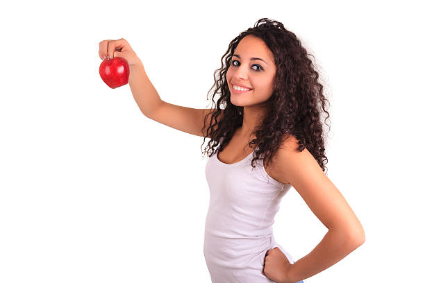 istock young woman holding apple. Isolated over white 499224241