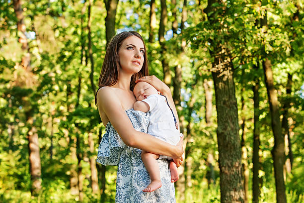 istock Mother with her child take rest in park 499225014