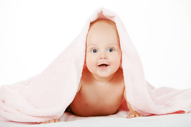 istock Caucasian baby boy covered with pink towel 499225406