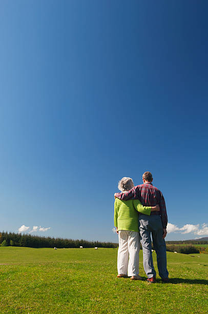 istock Senior couple standing in a field 499228492