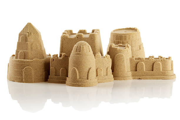istock Sandcastle at the beach isolated over white 499228577