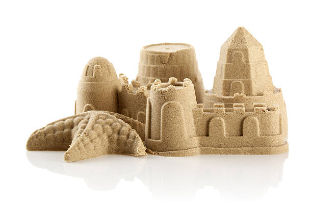 istock Sandcastle at the beach isolated over white 499228579